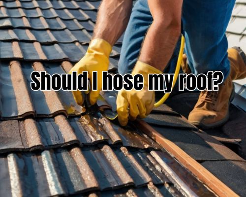 a roofer putting hose on roof